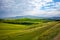 Tuscany landscape at sunrise. Typical for the region tuscan farm house, hills, vineyard. Italy