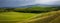 Tuscany landscape at sunrise. Typical for the region tuscan farm house, hills, vineyard. Italy