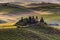 Tuscany landscape with traditional farm house, hills and meadow. Val d`orcia, Italy.