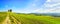 Tuscany, Maremma landscape. Old windmill and trees on top of the hill