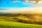 Tuscany misty panorama at sunset, rolling hills, fields, meadow.