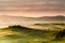 Tuscany road with cypress trees at sunst morning, Val d`Orcia,