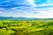 Tuscany, rural sunset landscape. Countryside farm, white road an