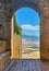 Tuscany seen through archway in Pienza