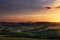 Tuscany spring, rolling hills on sunset. Volterra rural landscap