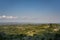 Tuscany sunny landscape. Typical for the region tuscan farm house, hills, vineyard. Italy