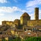 Tuscany, Volterra town skyline, church and campanile tower on sunset. Italy