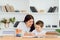 Tutor deals with the preschooler with a laptop, a real home interior, the concept of childhood and learning