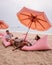 Tutu beach Pattaya Thailand, couple relax on the beach, men and woman on retro beach setting in Jomtien