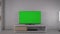 TV with blank green screen in modern home interior in living room. Zoom in. Modern living room with television