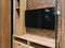 TV with blank screen and shelf cabinet at night, interior design