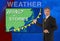 TV news weather man meteorologist anchorman reporter with map of Asia on the screen