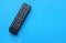 TV remote control on blue background