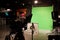 TV studio. Camcorder and green chromakey. Shooting television press news and movies