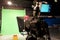 TV studio. Camcorder and green chromakey. Shooting television press news and movies