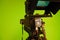 TV video camera on the background of a green chroma key. Camcorder lens