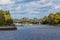 Tvertsa river flows into the Volga river in Tver, Russia. Road bridge over the river and the city pier