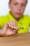 Tween boy holding fidget spinner, closeup