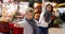 Tween boy pulling mothers hand at festive Christmas fair