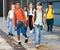 Tween boys and girls with backpacks walking to shool