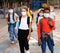 Tween boys and girls in protective masks going to school lessons