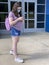 Tween Girl Texting Wearing Surgical Mask