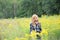 Tween redhead girl in summertime field