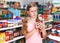 Tweenage girl buying food in supermarket