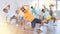 Tweenager dancing krump with group of children in dance studio