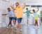 Tweenager dancing krump with group of children in dance studio