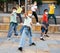 Tweens in protective masks dancing hip-hop on summer street