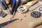 Tweezers, batteries, screwdrivers, dials, wrist watch, verious types of tools for watch repairing