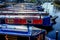 Twelve long traditional british canal boats moored directly next