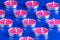 Twelve scented candles on a blue background