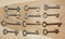 Twelve symmetrically arranged keys on a wooden background.