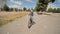 A twelve-year-old girl riding her bike on a warm summer day.