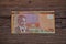 A twenty dollar Namibia banknote on a wooden background