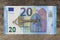 Twenty euro banknote with old vintage key. Money opens many doors. Ancient key on banknotes