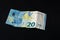 Twenty memorable euros lie on a black background