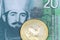A twenty Serbian dinar bank note with a gold krugerrand coin