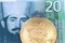 A twenty Serbian dinar bank note with a golden, physical bitcoin