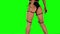 Twerking young woman. Green