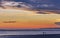 Twho silhouettes on Inverloch foreshore beach at sunset, Austral