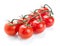 Twig of fresh cherry tomato on white