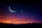 Twilight backdrop: Crescent moon, star, Arabic text, and vibrant sky