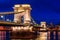 Twilight in Budapest, the Chain Bridge over the Danube, the reflection of night lights on the water