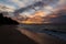 Twilight evening sunset. Waves, surf, swash at empty beautiful sandy beach on Foa island, Haapai, Tonga, Polynesia, Oceania.