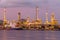 Twilight oil refinery with shipping