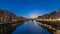 Twilight sky scene of Ponte Santa Trinita Holy Trinity Bridge day to night timelapse over River Arno