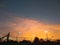 Twilight sky with sunset light effected on clouds and silhouett of basketball court